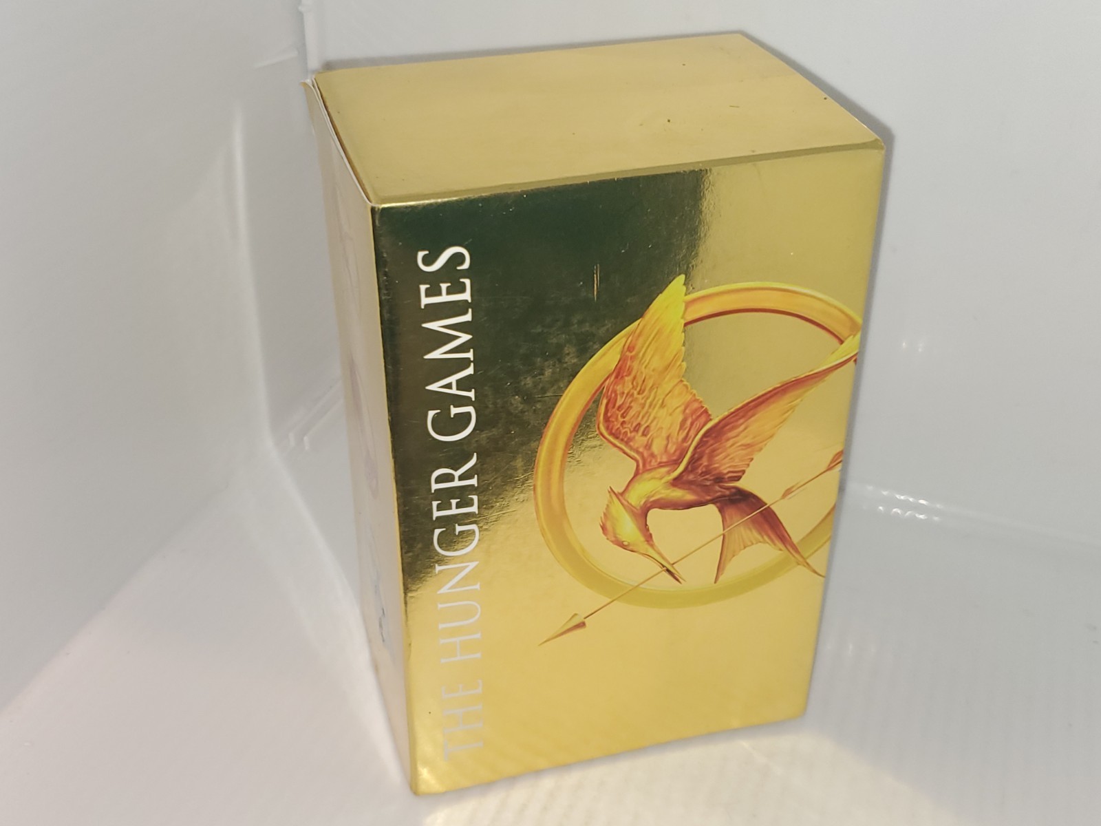 The Hunger Games Box Set: Foil Edition, Paperback by Suzanne Collins.